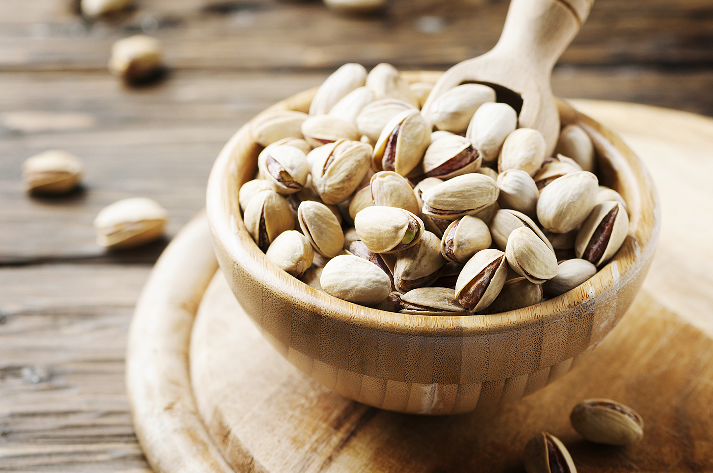 Salt pistachios on the wooden table